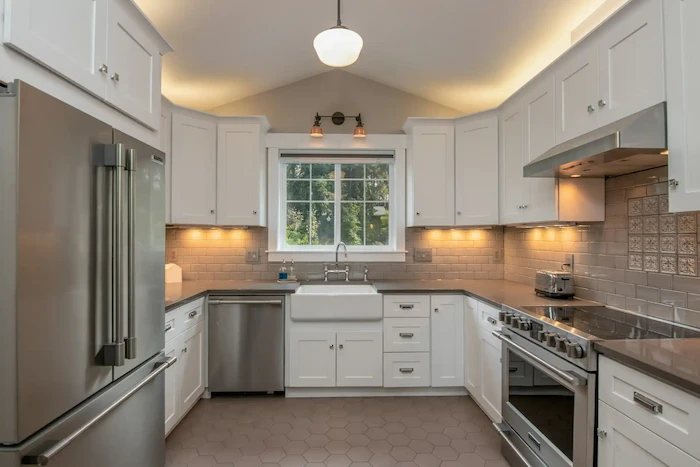 Custom floor-to-ceiling kitchen cabinet installation in Sunnyvale home with integrated lighting and soft-close drawers
